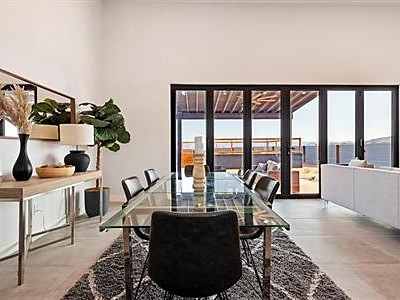Dining area and rooftop deck from a recent new-construction project